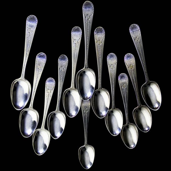 A set of 12 Georgian Silver Teaspoons with Bright-Cut Engraving