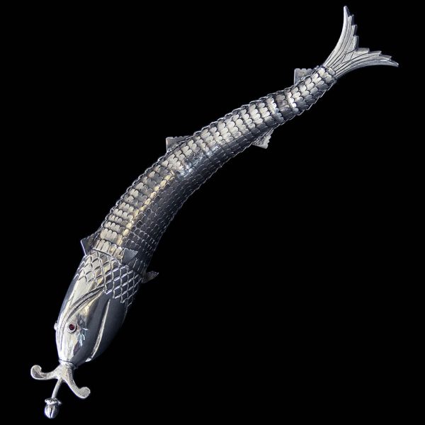 A white metal Articulated Fish